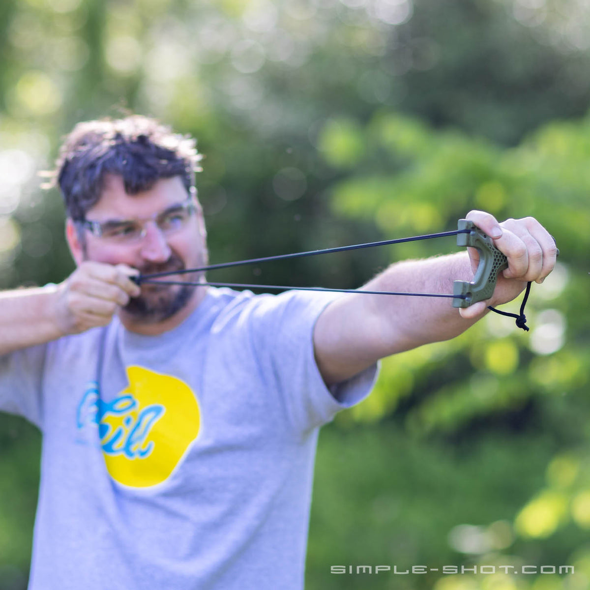 Shooter at full draw with the Torque slingshot