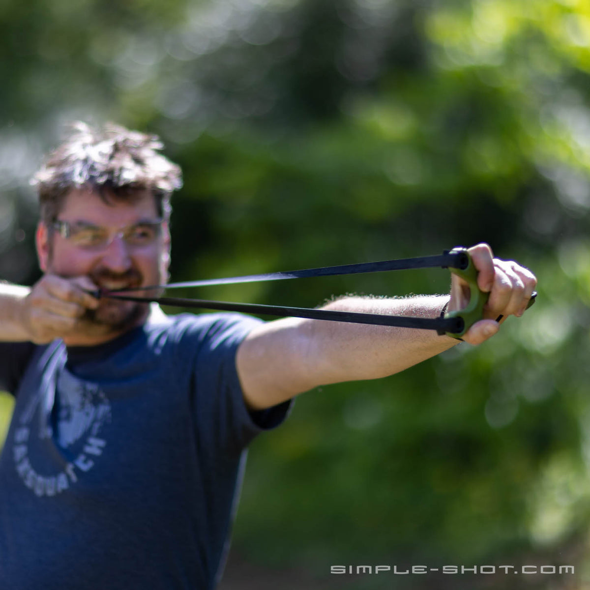 BeanFlip slingshot in hand outdoors