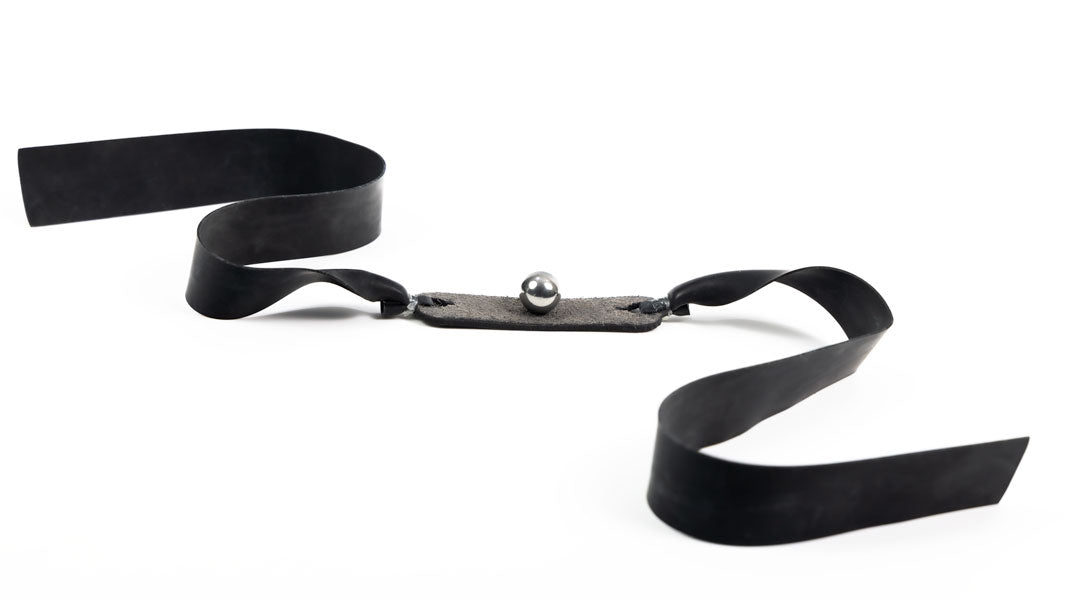 Heavy Duty 7/16-inch flat band cradling a steel ball
