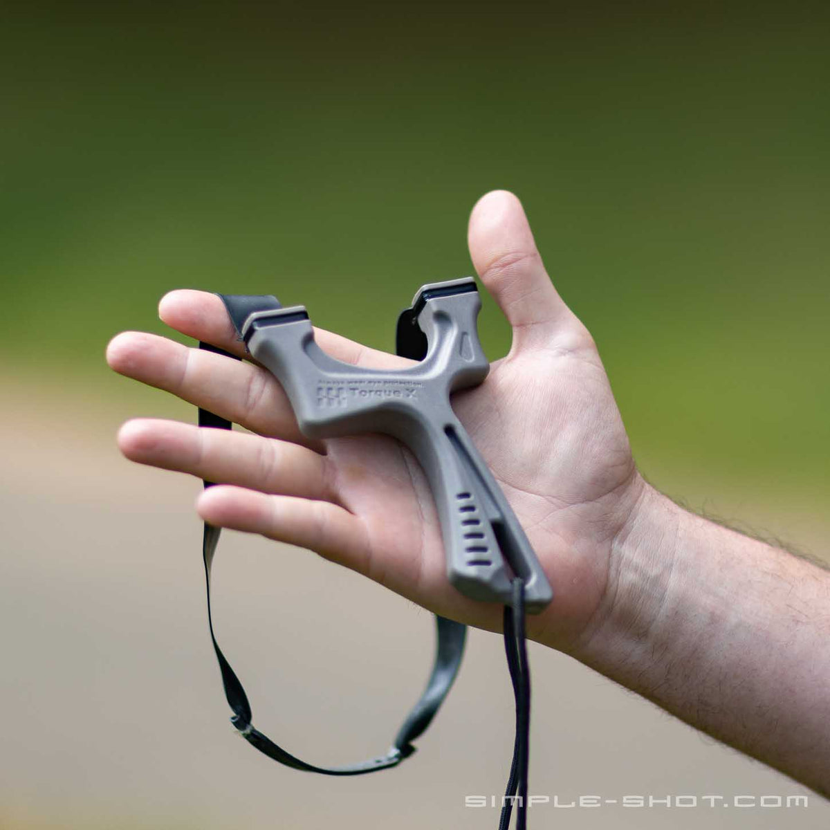 Torque X slingshot resting flat in an open hand