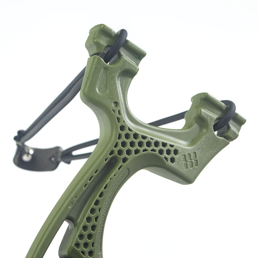 Green Torque slingshot banded up, close view