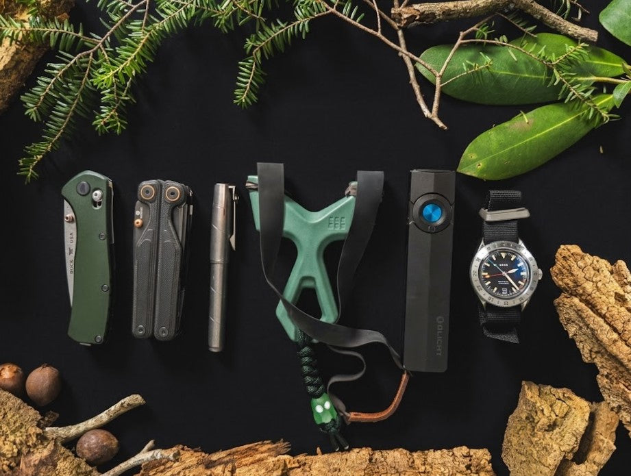 Sea Glass SimpleShot Slant Roller in an everyday-carry flat lay with a pocket knife, multitool, pen, flashlight, and watch