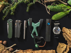 Sea Glass SimpleShot Slant Roller in an everyday-carry flat lay with a pocket knife, multitool, pen, flashlight, and watch
