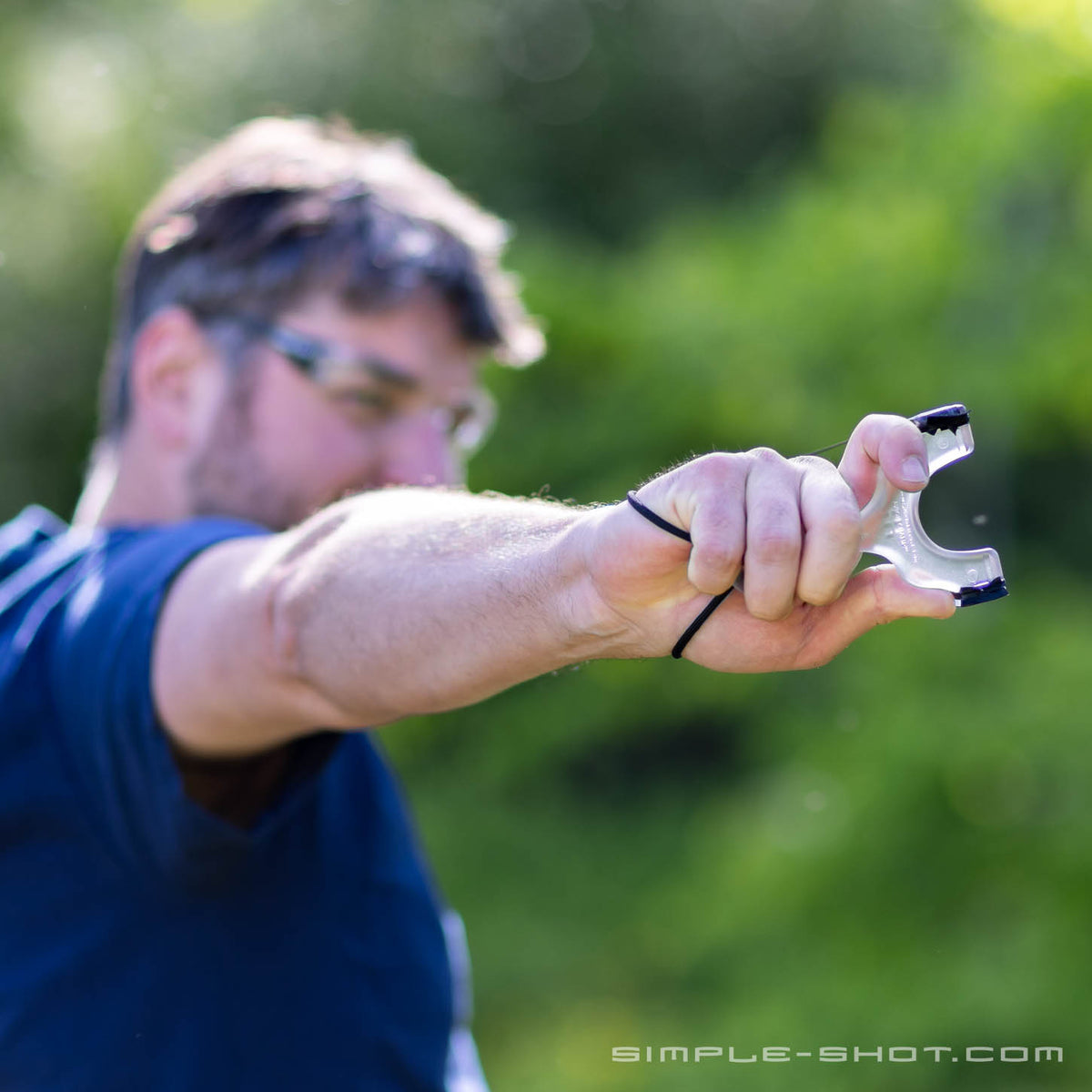 Shooter aiming an Axiom Champ outdoors