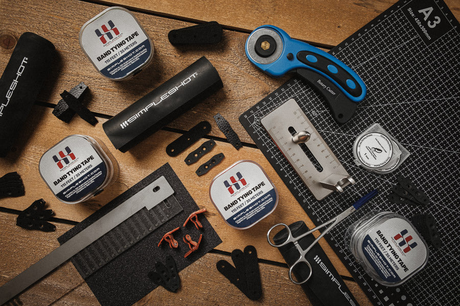 Band tying tape dispensers on a DIY band-making workbench