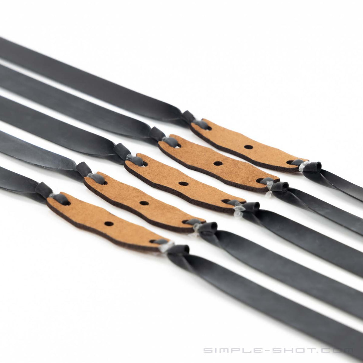 Five matching clay shooting flat bands in a row