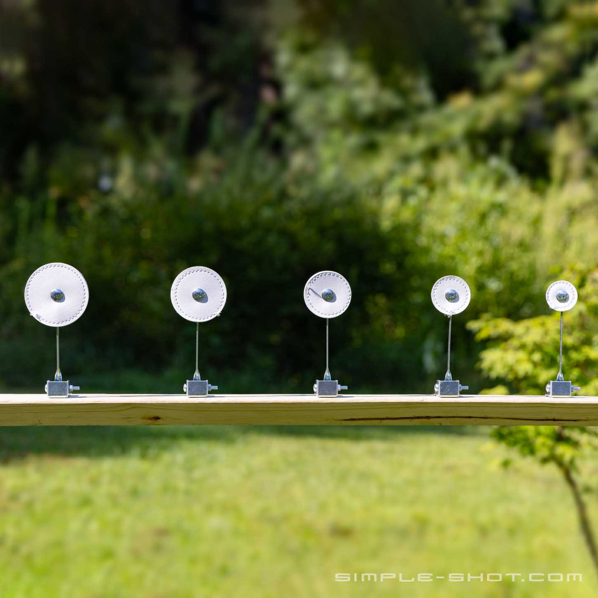 Five SimpleShot self-resetting knockdown targets set up for competition