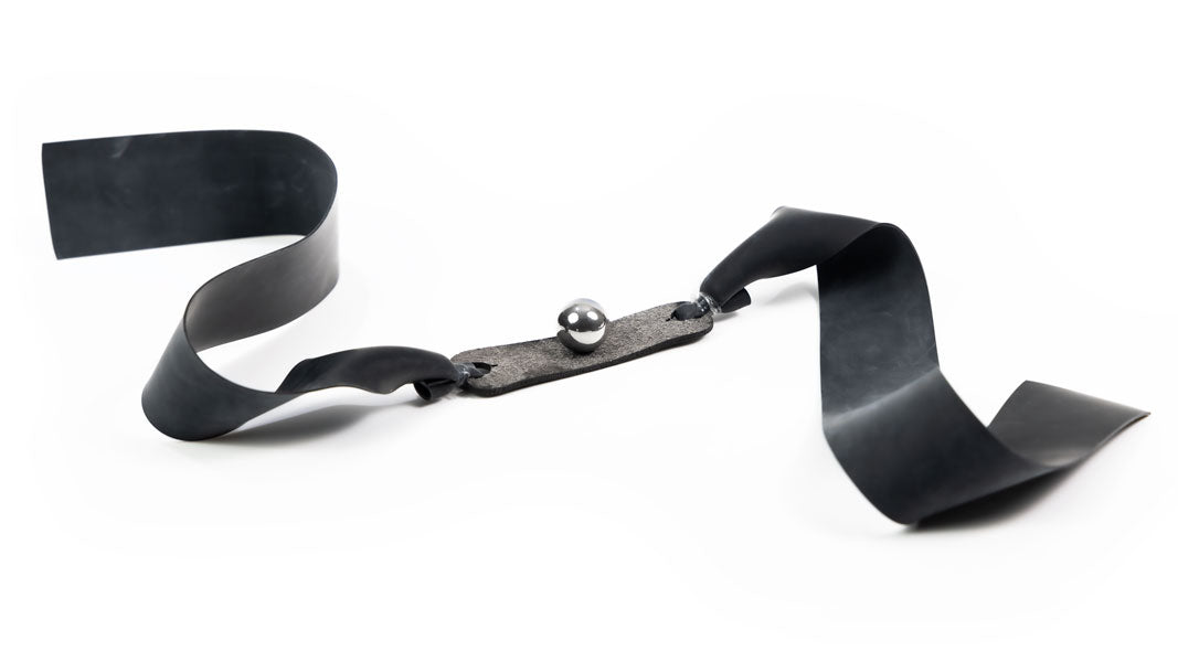 Nitro 1/2-inch flat band cradling a large steel ball