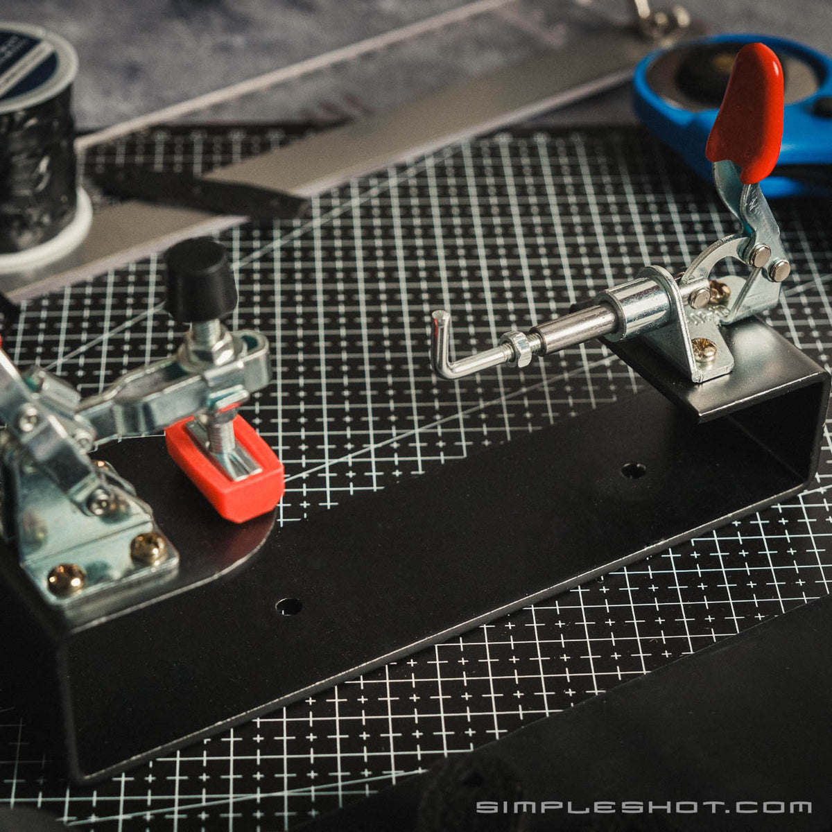 Band Tying Jig on a cutting mat with scissors