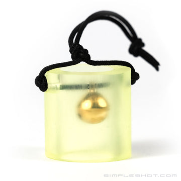 Bell Target, brass bell inside a clear yellow tube on a black cord