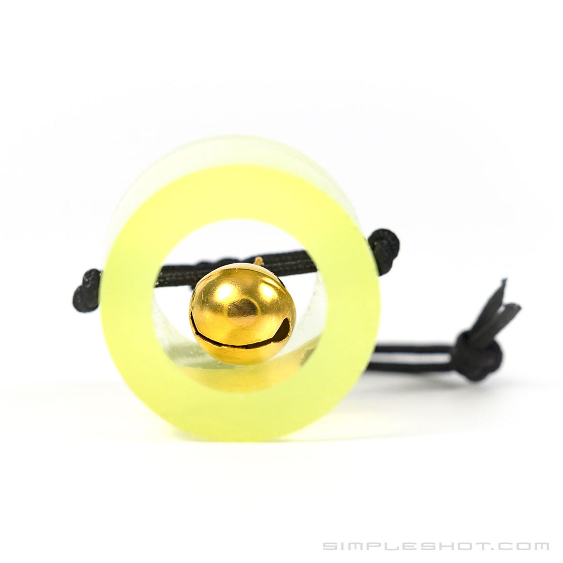 Bell Target, brass bell inside a clear yellow tube on a black cord