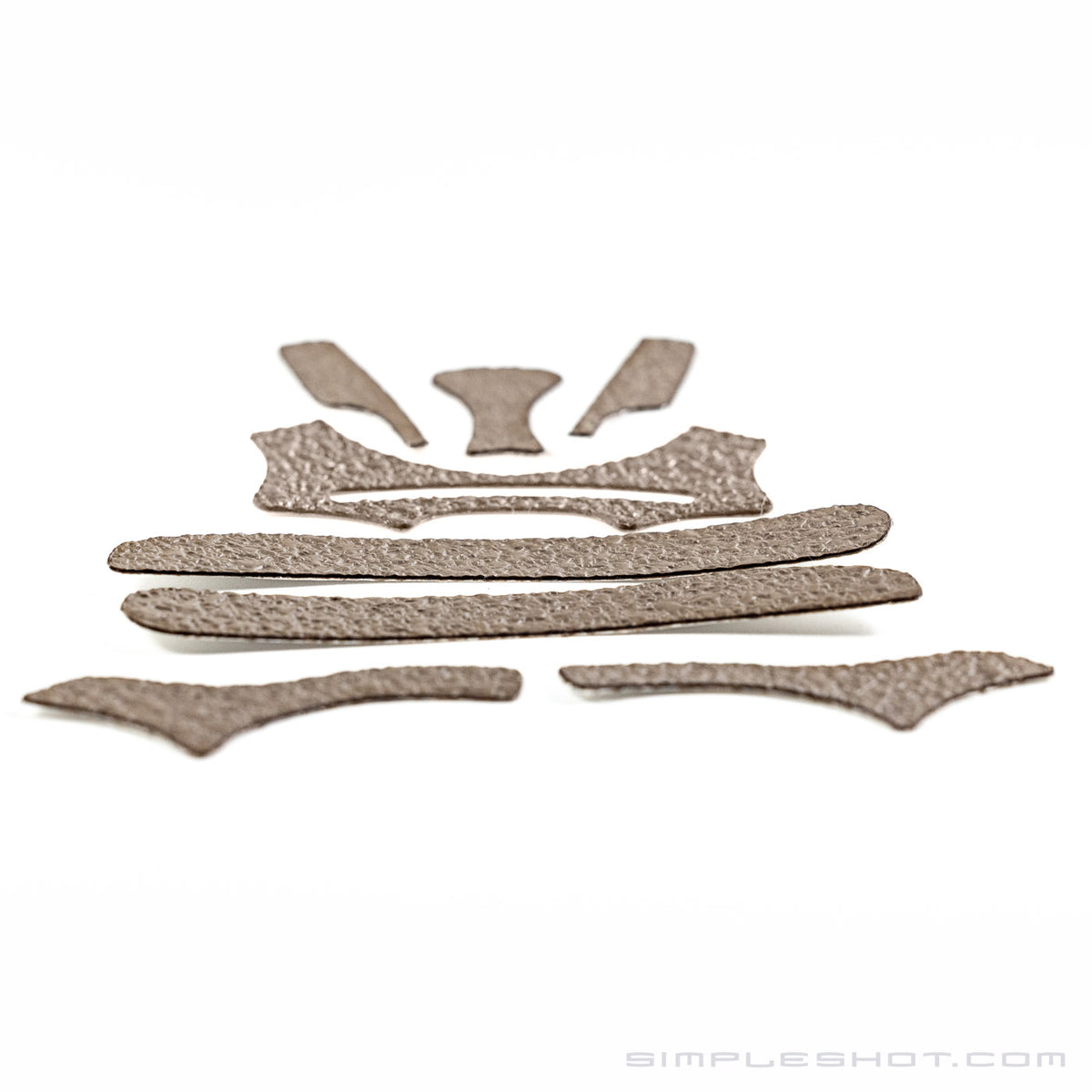 Custom-Cut Slingshot Grips in tan, full set of cut pieces laid flat
