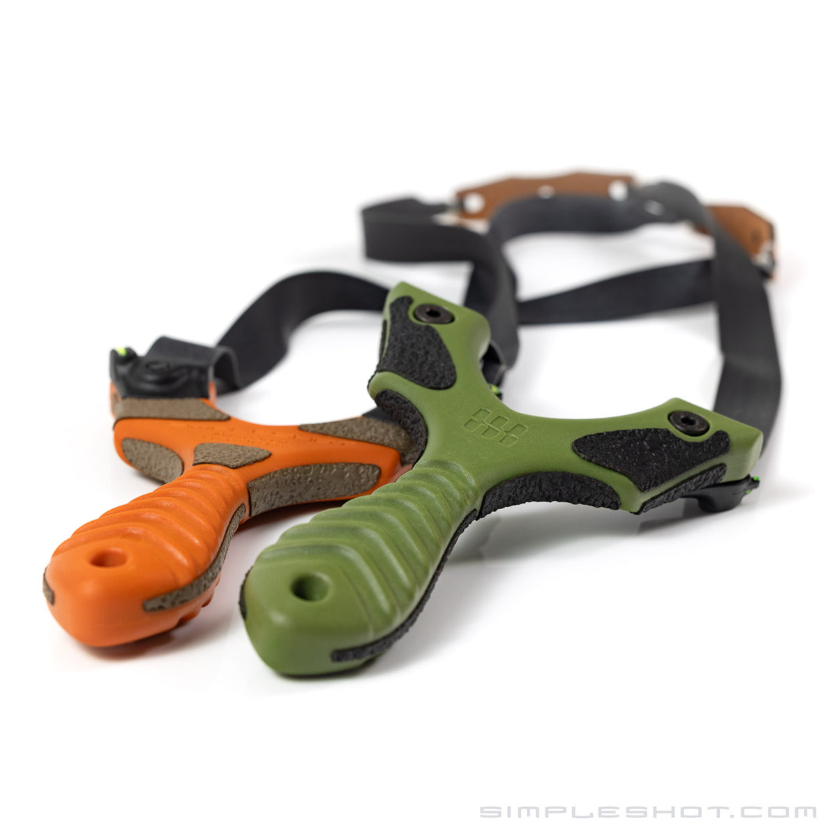 Custom-Cut Slingshot Grips installed on orange and green slingshots with bands