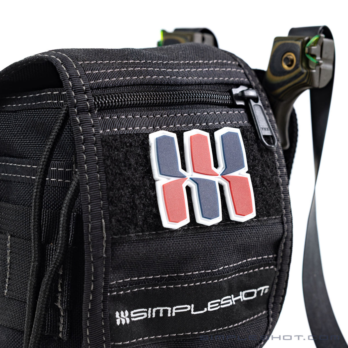 SimpleShot Logo Patch on a black bag with a slingshot nearby