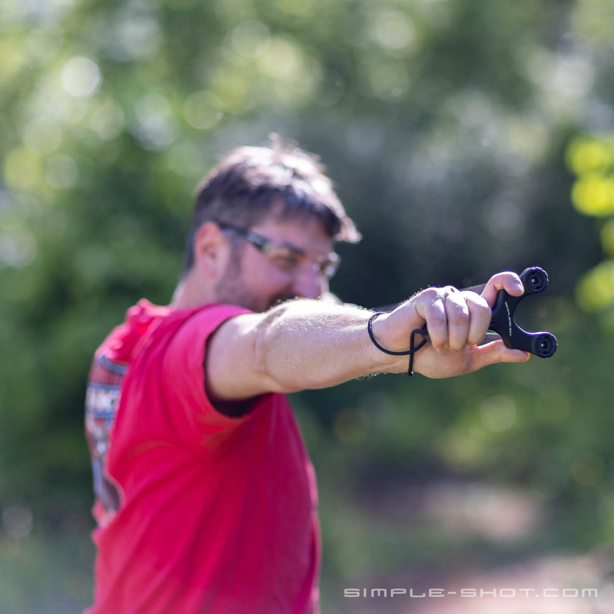 Shooting the Axiom Ocularis PRO slingshot outdoors