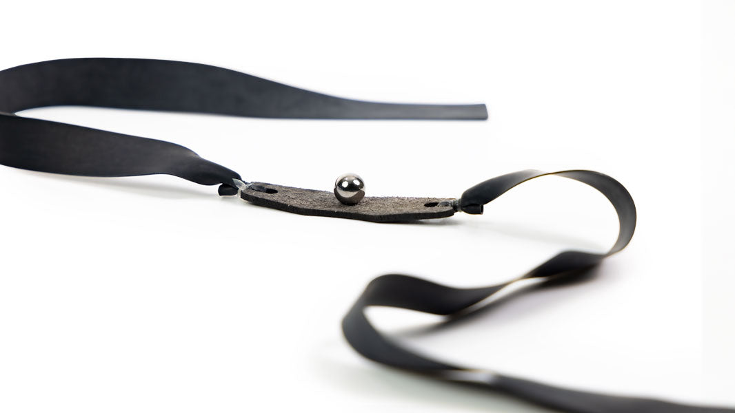 Target 5/16-inch flat band cradling a steel ball