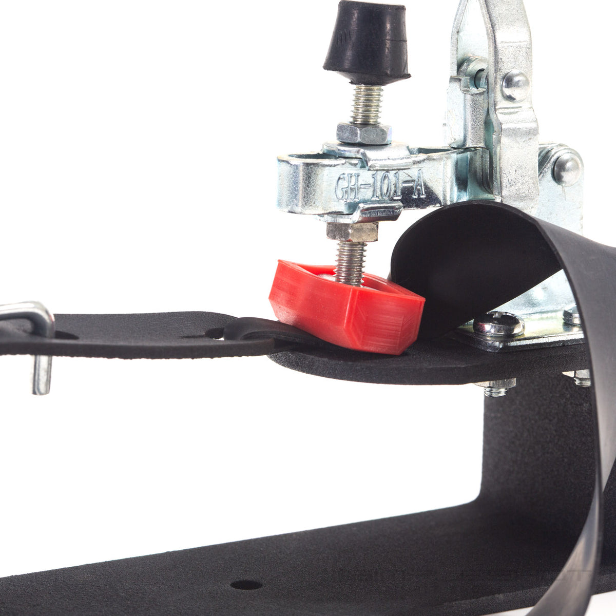 Band Tying Jig clamp and red pad holding a flat band, side close-up