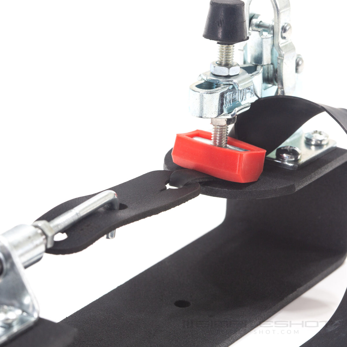 Band Tying Jig clamp pressing down on a flat band, close-up
