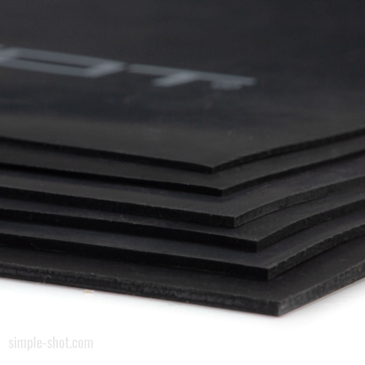 SimpleShot Premium Latex Sheet, stacked black sheets close-up